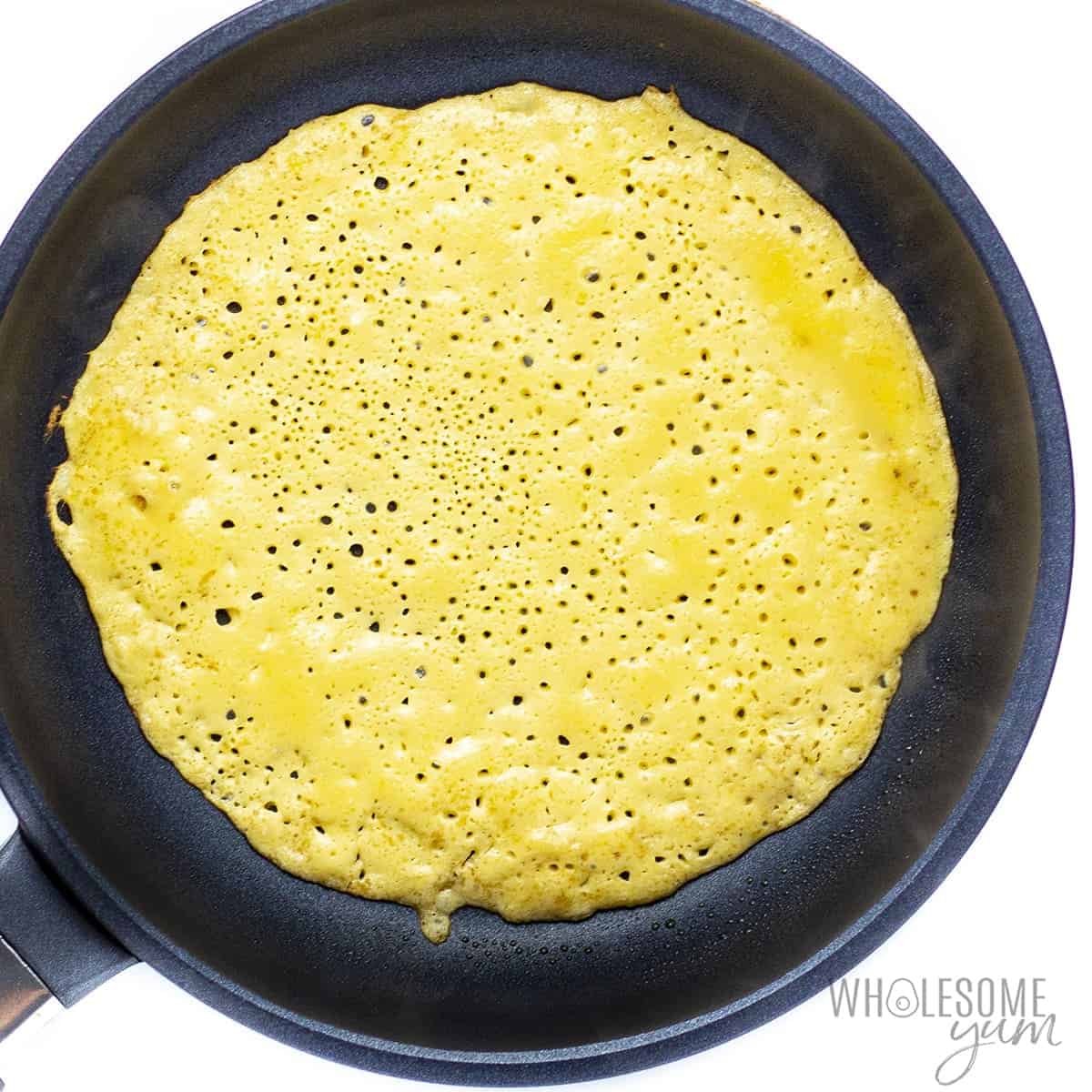 Cooking paleo tortillas in a nonstick skillet.