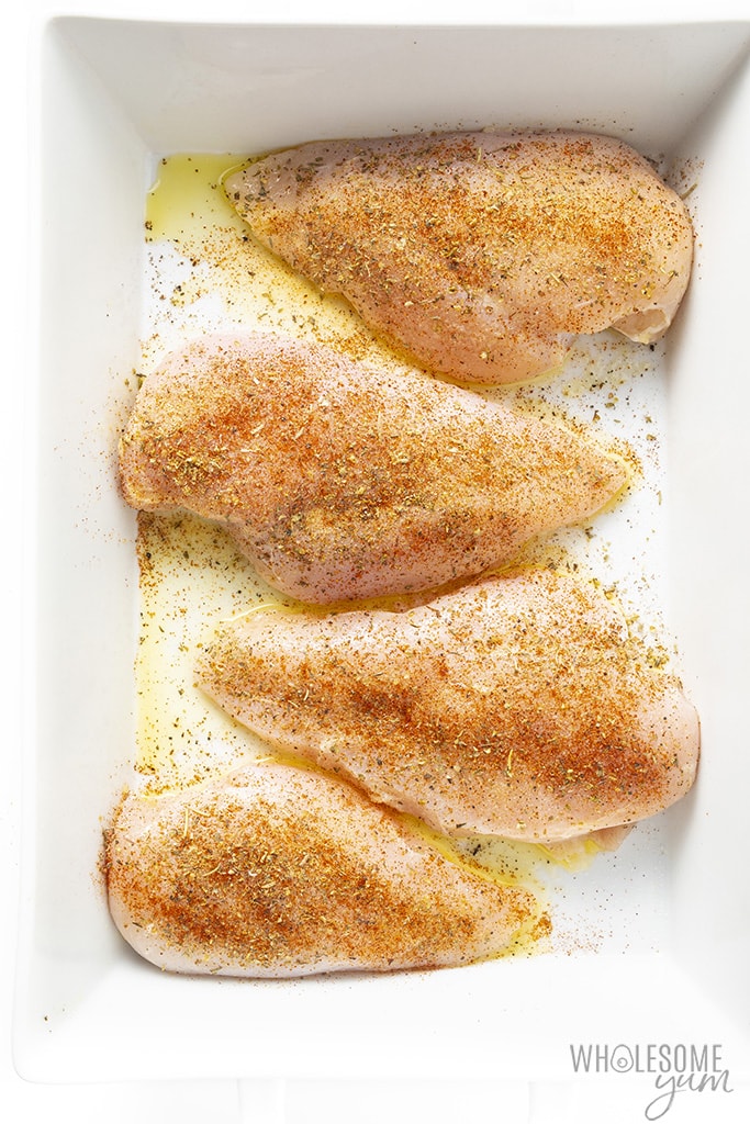 Chicken breast in a baking dish with seasoning