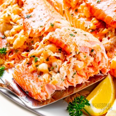 Crab stuffed salmon recipe picked up with a spatula.