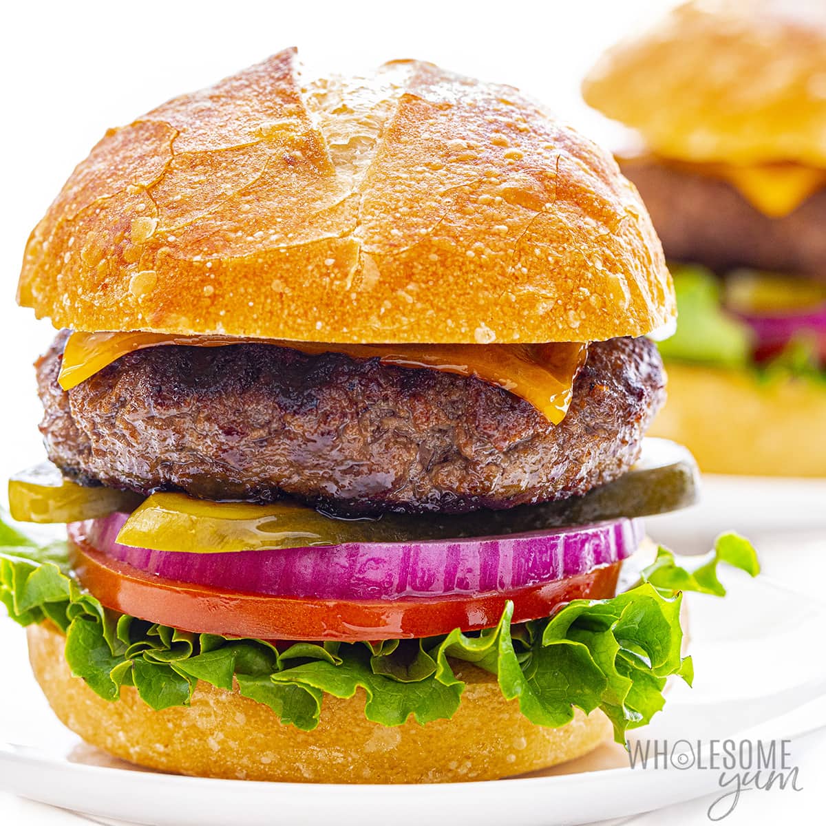 Best burger recipe with juicy burgers on buns with fixings.