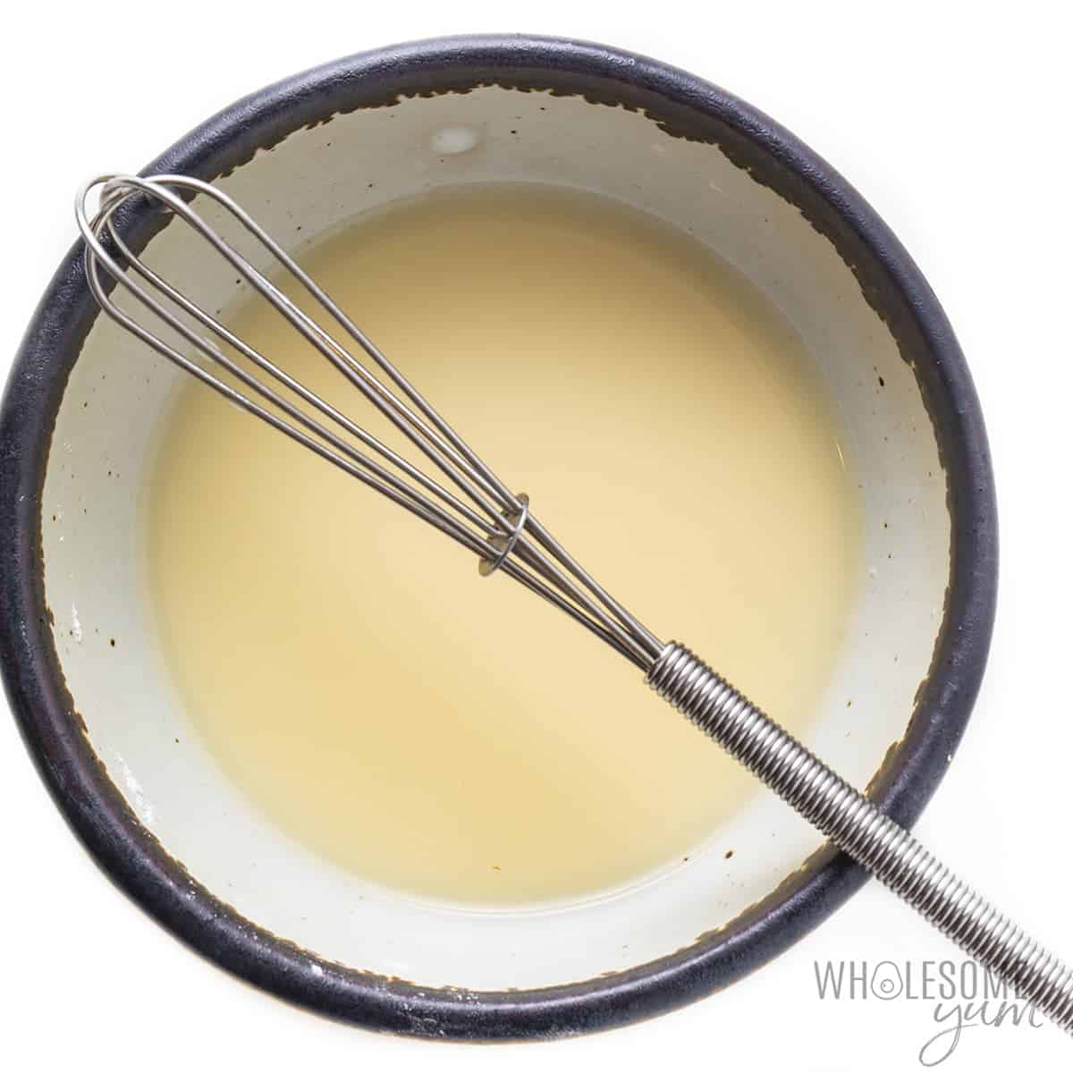 Broth and arrowroot powder whisked in a bowl