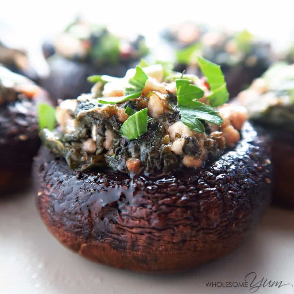 This simple spinach stuffed mushrooms recipe with feta & garlic is like an easier, healthier version of Greek spanakopita. Naturally low carb & gluten-free. Only 8 ingredients!