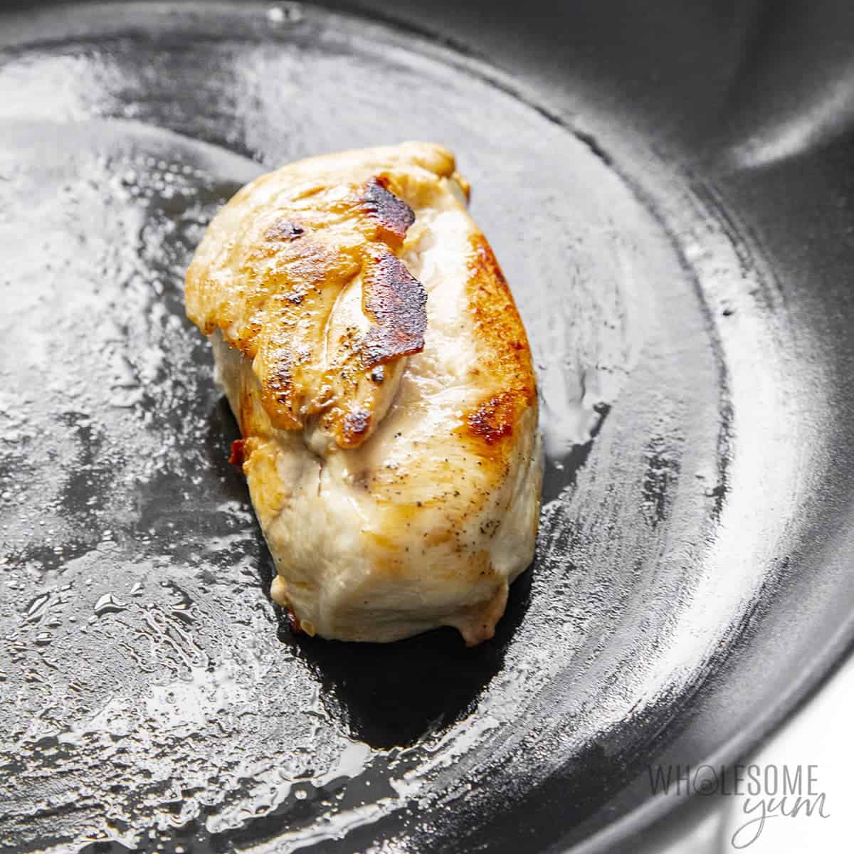 Cooking chicken breast in skillet