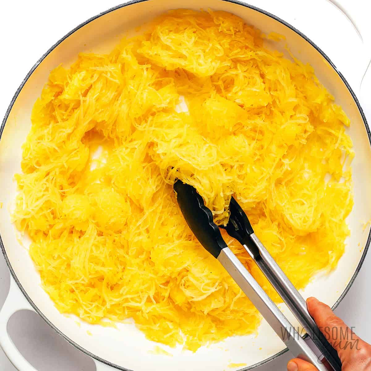 Drying the spaghetti squash noodles in the skillet.