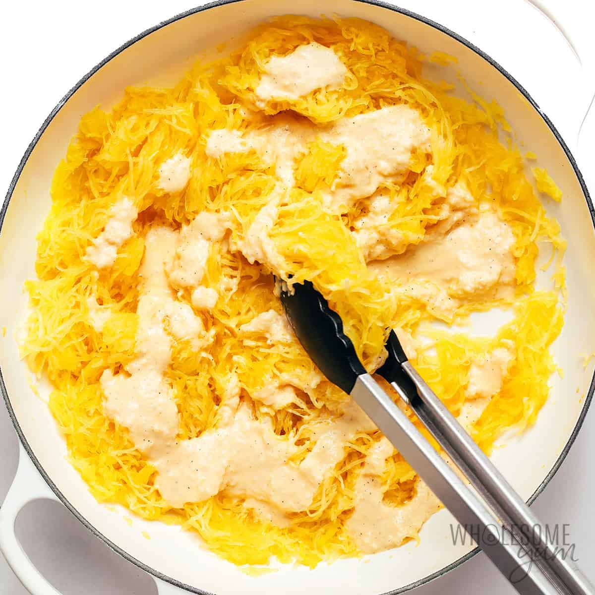 Carbonara sauce poured over spaghetti squash noodles.