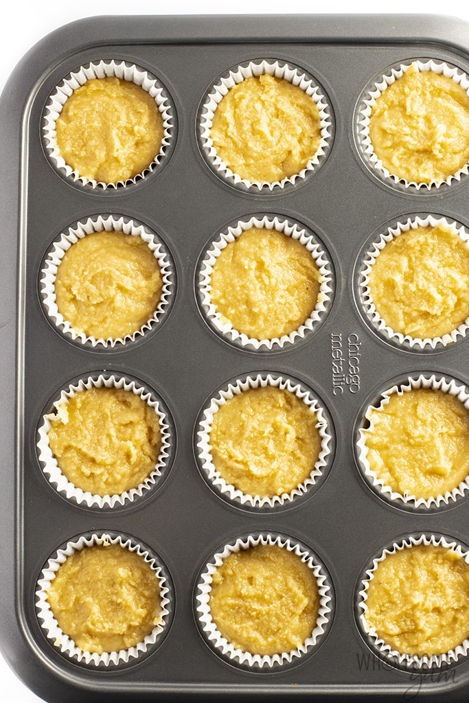 Overhead view of cupcake batter in a muffin tin