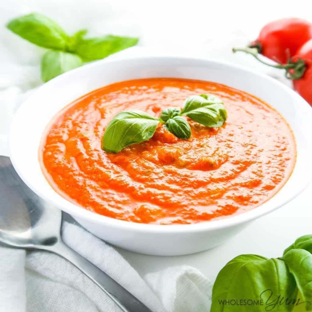 5-Ingredient Roasted Tomato Soup (Low Carb, Gluten-Free) - This easy 5-ingredient soup is bursting with roasted tomatoes and fresh basil. Low carb, gluten-free, grain-free, and keto, with a paleo option.