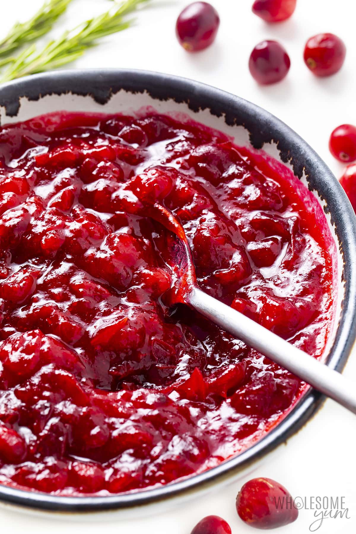 Keto cranberry sauce on a spoon. 