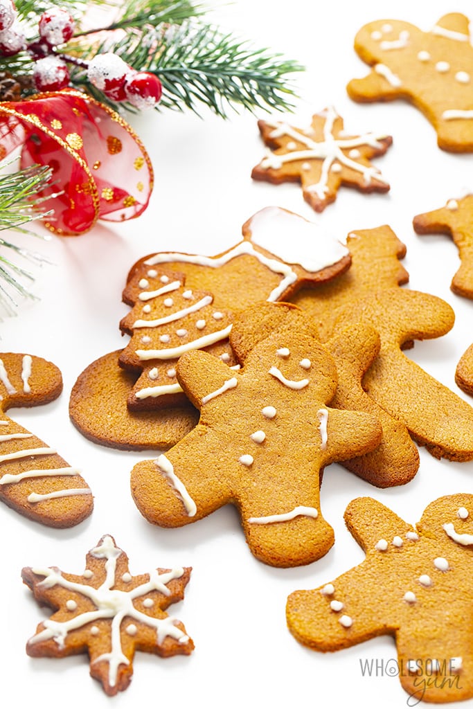 Pile of sugar-free gingerbread cookies with holiday decorations