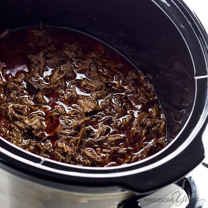Chipotle Beef Barbacoa Recipe Copycat in a Slow Cooker (Crock Pot) - If you love barbacoa beef, you have to try this copycat Chipotle barbacoa recipe in a slow cooker. It's healthy, easy, naturally low carb, paleo, gluten-free and fall-apart delicious. The best Crock Pot barbacoa ever!