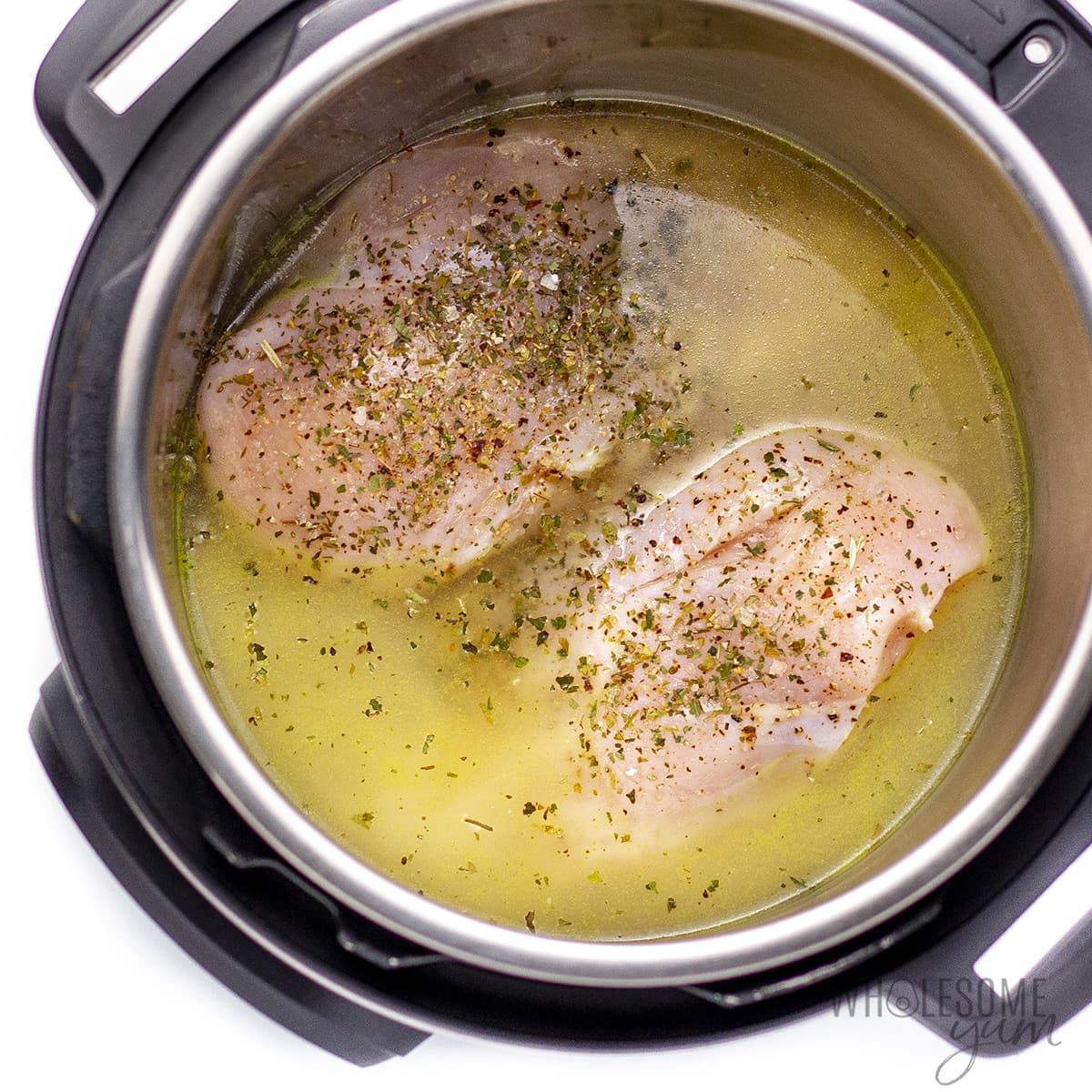 Raw chicken breasts in the Instant Pot.