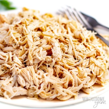 Instant Pot shredded chicken piled on a plate.