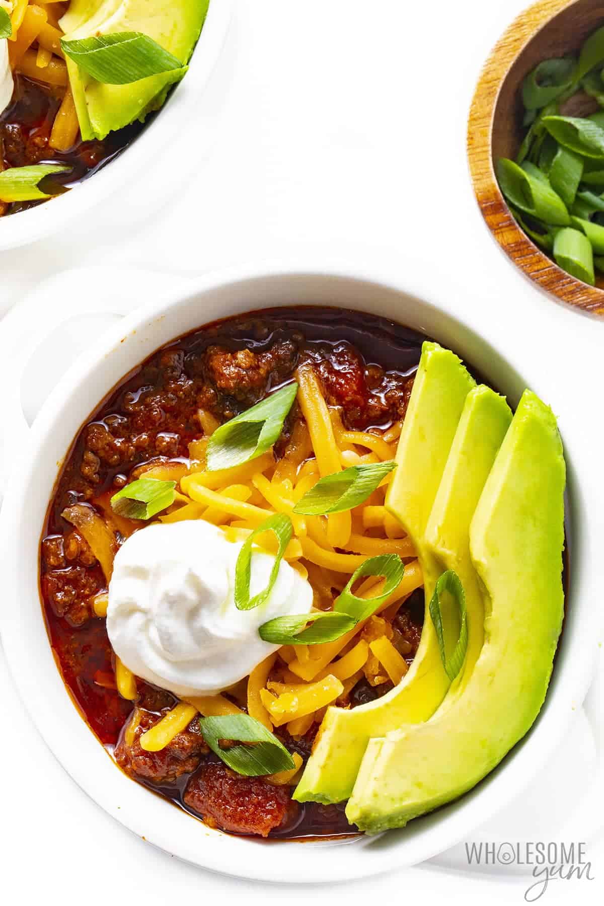 Keto friendly chili in bowls with toppings.