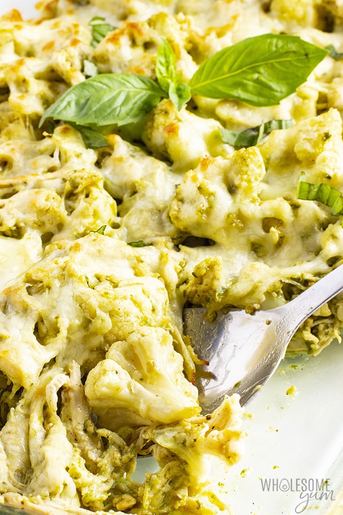 Close up view of keto chicken cauliflower casserole being served with a spoon