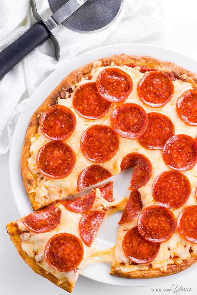 Fathead Pizza Crust Recipe (Low Carb, Keto, Gluten-free, Nut-free) - 4 Ingredients - This low carb keto Fathead pizza crust recipe with coconut flour is so easy with only 4 ingredients! It's nut-free and gluten-free, too.