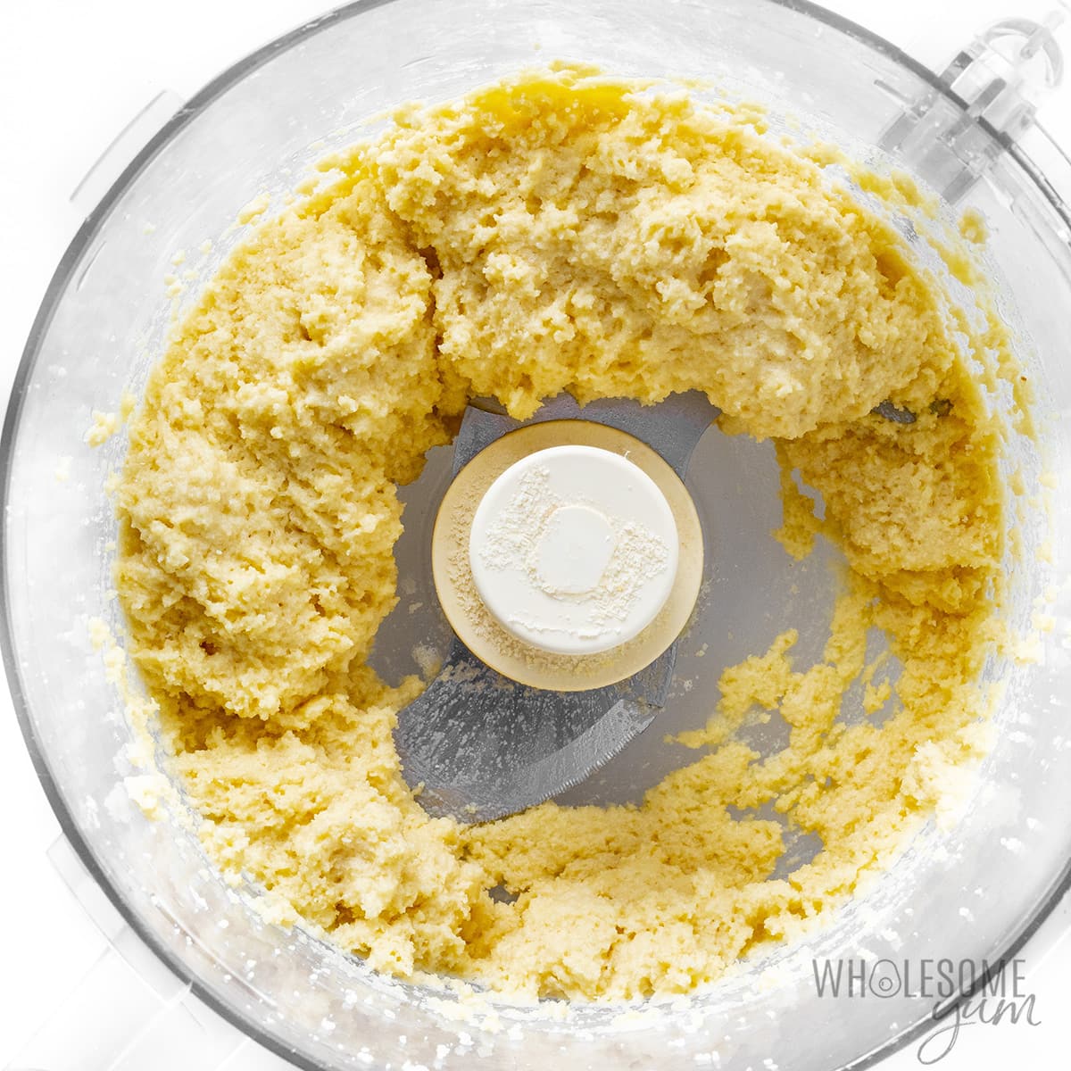 Eggs added to dry ingredients in food processor.