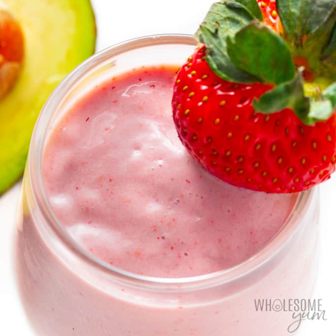 Strawberry avocado smoothie recipe in a glass with garnishes