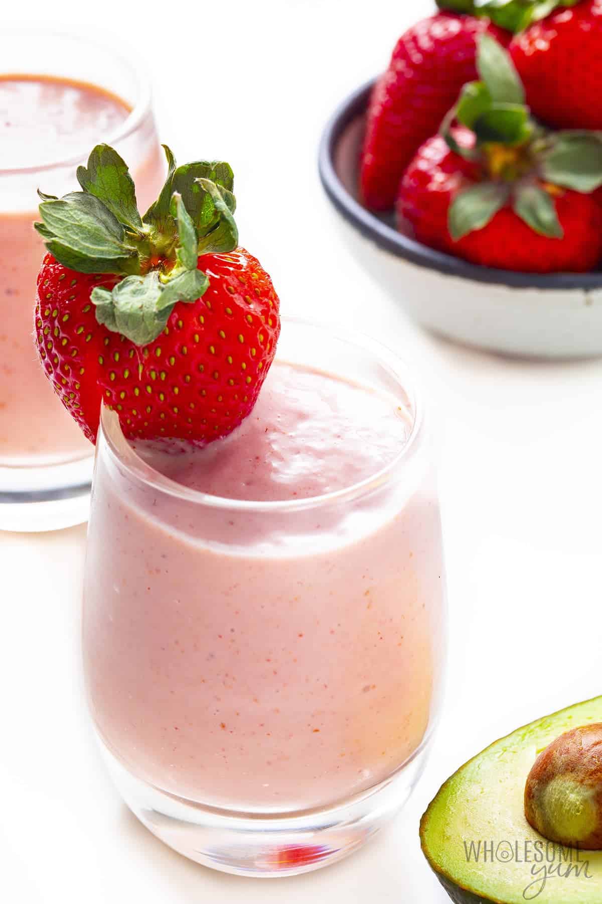 Strawberry smoothie garnished with fresh berry