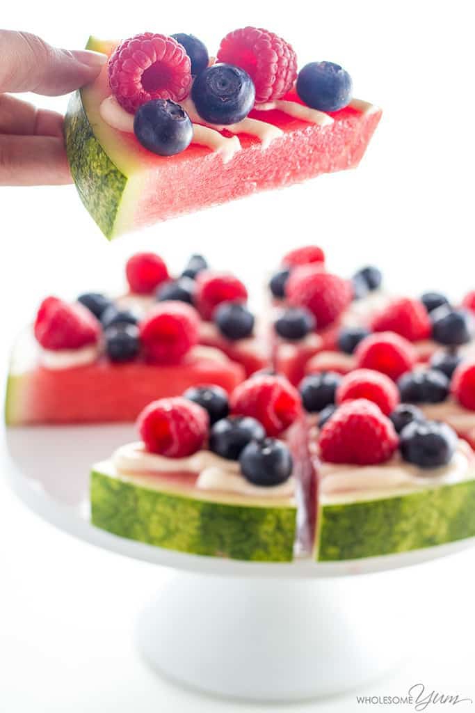 This quick and easy watermelon pizza recipe with berries, and cream cheese icing makes a perfect healthy summer dessert. Ready in 10 minutes! It's low carb and gluten-free, too.