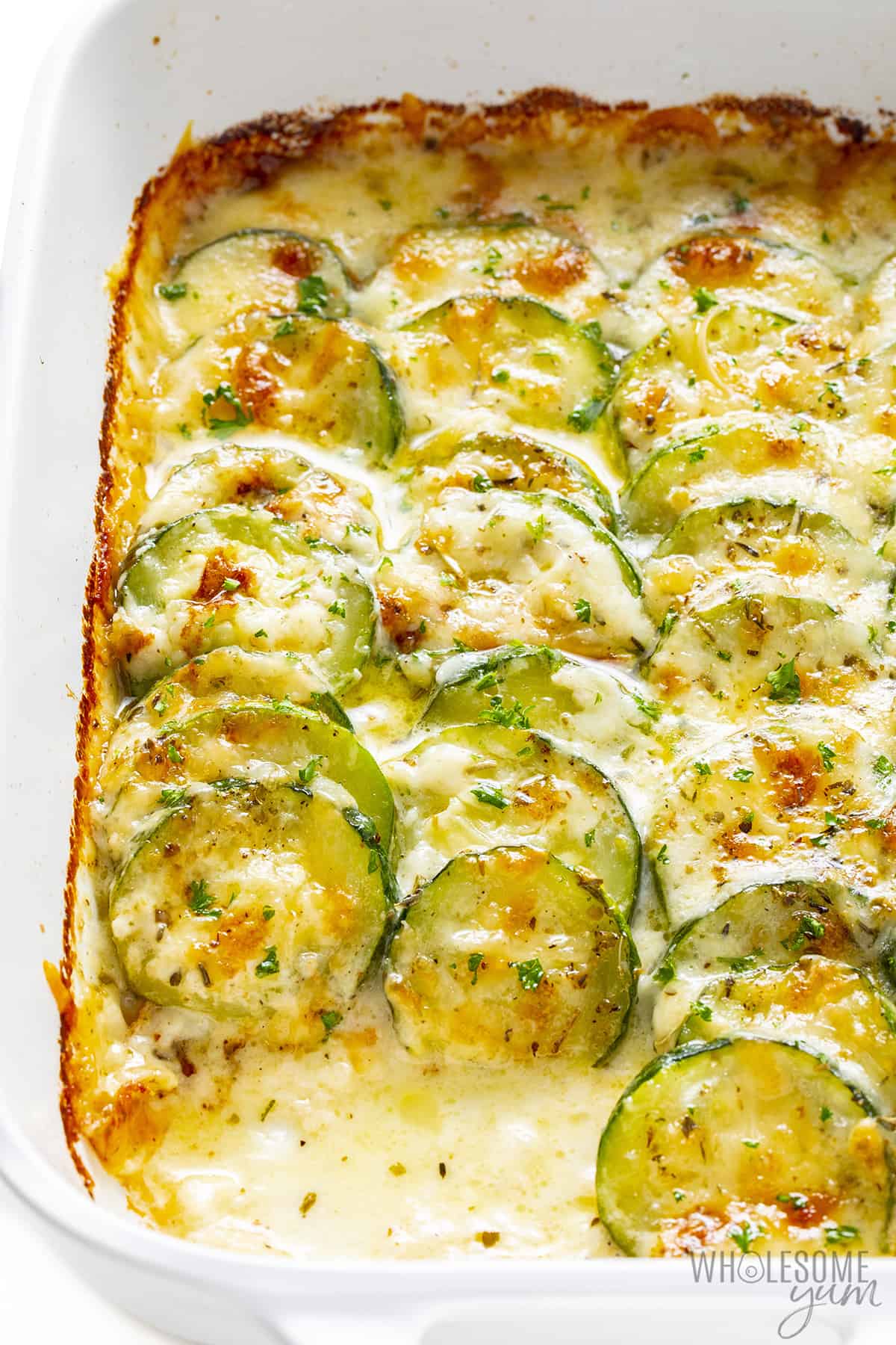 Zucchini gratin close up with some removed.