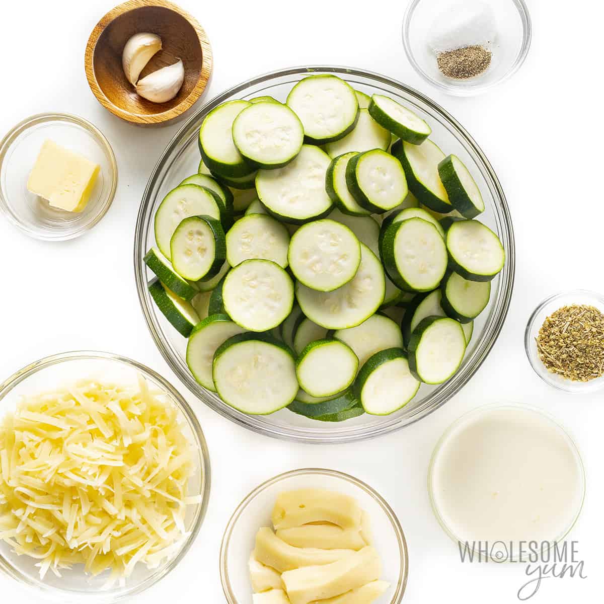 Zucchini casserole recipe ingredients in bowls.