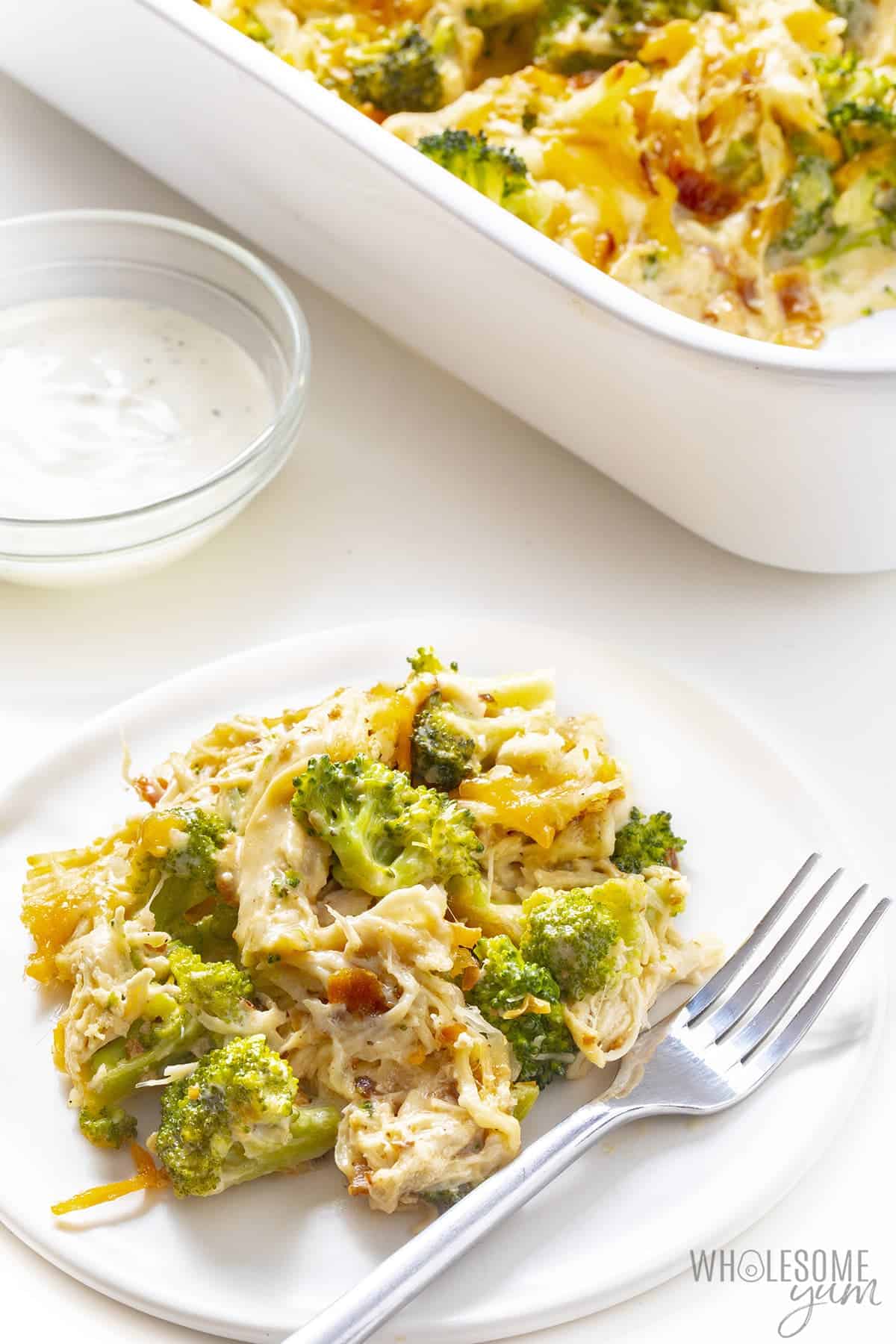 Creamy chicken bacon casserole on a plate with fork
