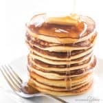 Coconut flour pancakes recipe - stack shown with butter and syrup