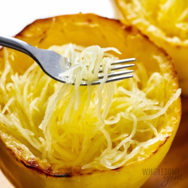 Roasted spaghetti squash recipe picked up with a fork.
