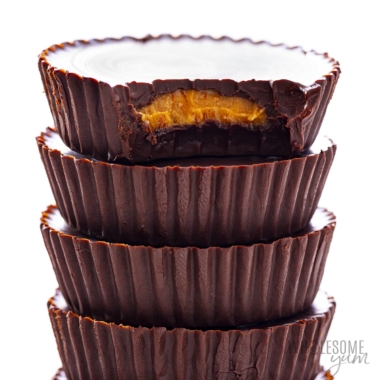 Keto peanut butter cups stacked on top of each other.