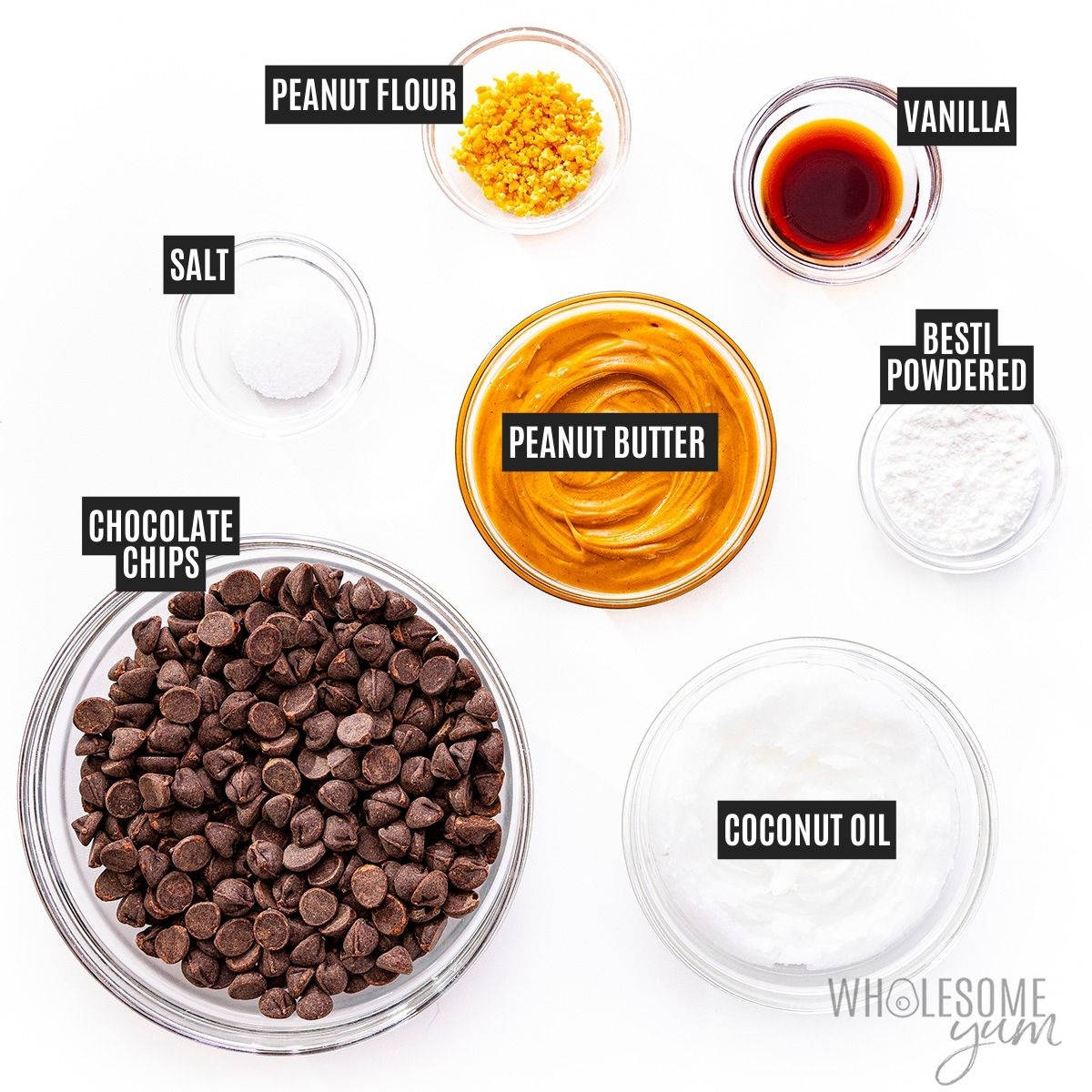 Recipe ingredients in bowls: chocolate chips, nut butter, Besti, peanut flour, coconut oil, salt, and vanilla.