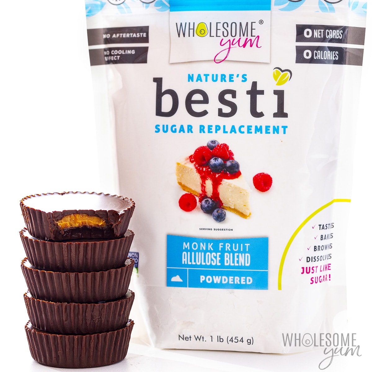 Stacked sugar free peanut butter cups next to bag of Besti.
