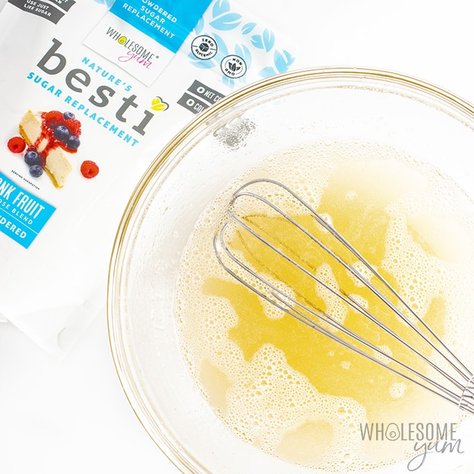 Gelatin mixture and sweetener mixture combined with a whisk and a bag of Besti