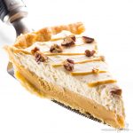 salted caramel pie being served with a pie server Detail: easy-low-carb-salted-caramel-pie-recipe-3