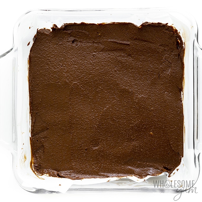 Avocado brownie batter spread in a baking dish