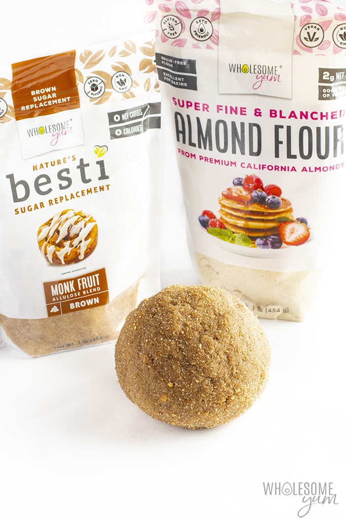 Sugar-free graham cracker dough rolled into a ball in front of a bag of Besti brown monk fruit allulose blend and Wholesome Yum almond flour