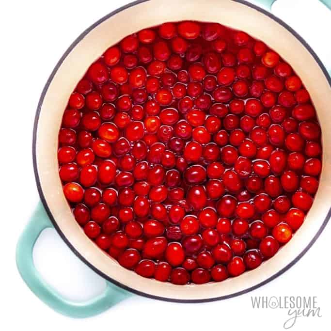 Cranberries in pot of hot water