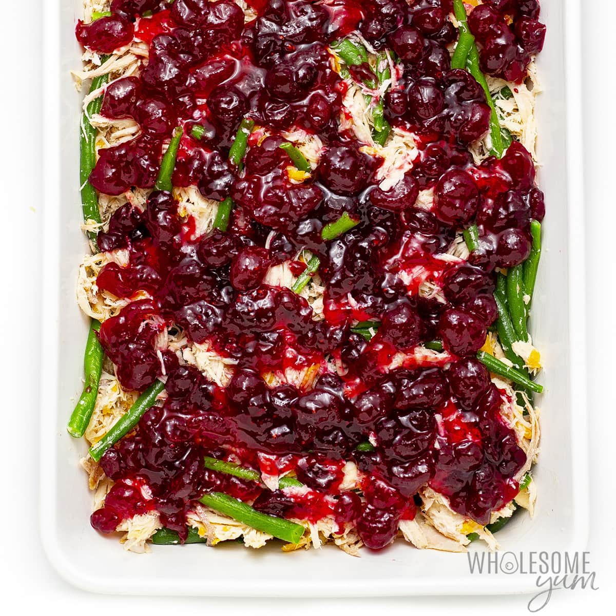 Cranberry sauce on top of leftover Thanksgiving turkey mixture. 