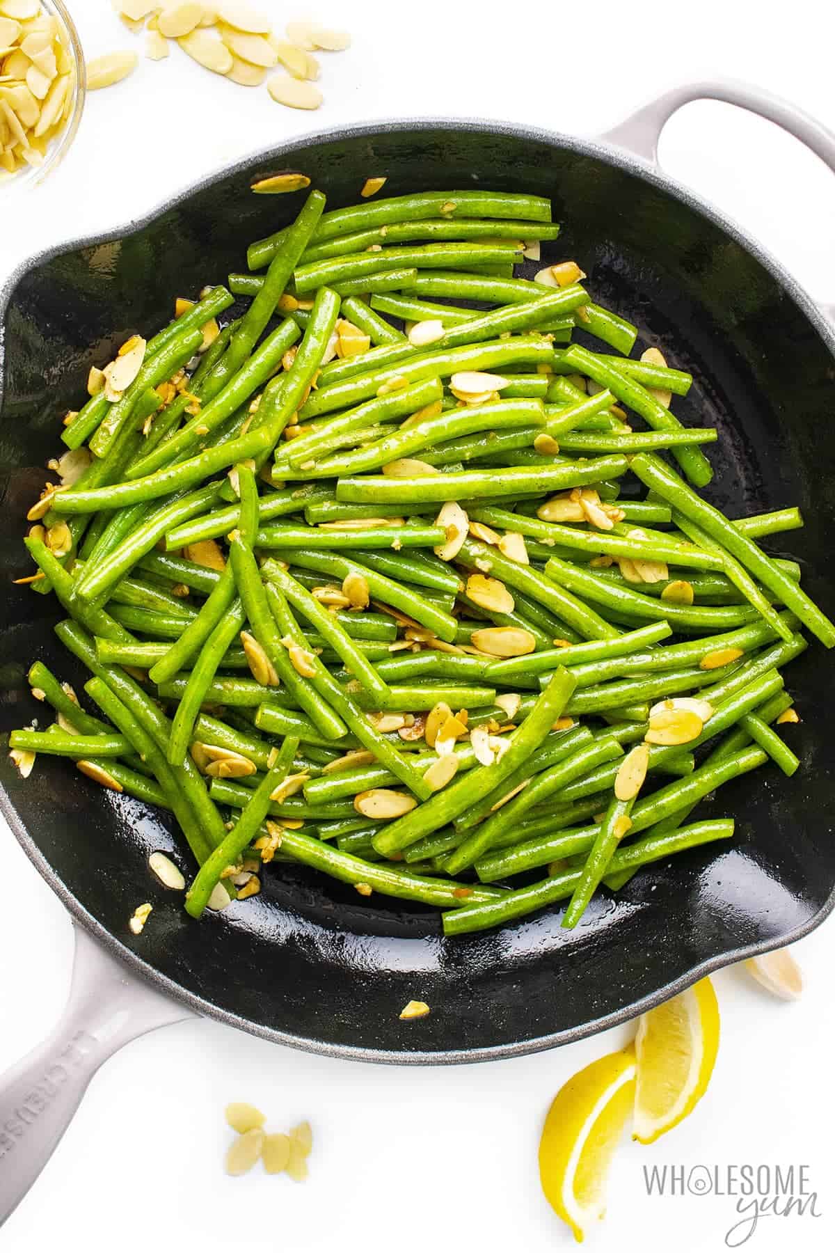 Green beans almondine in a skillet.