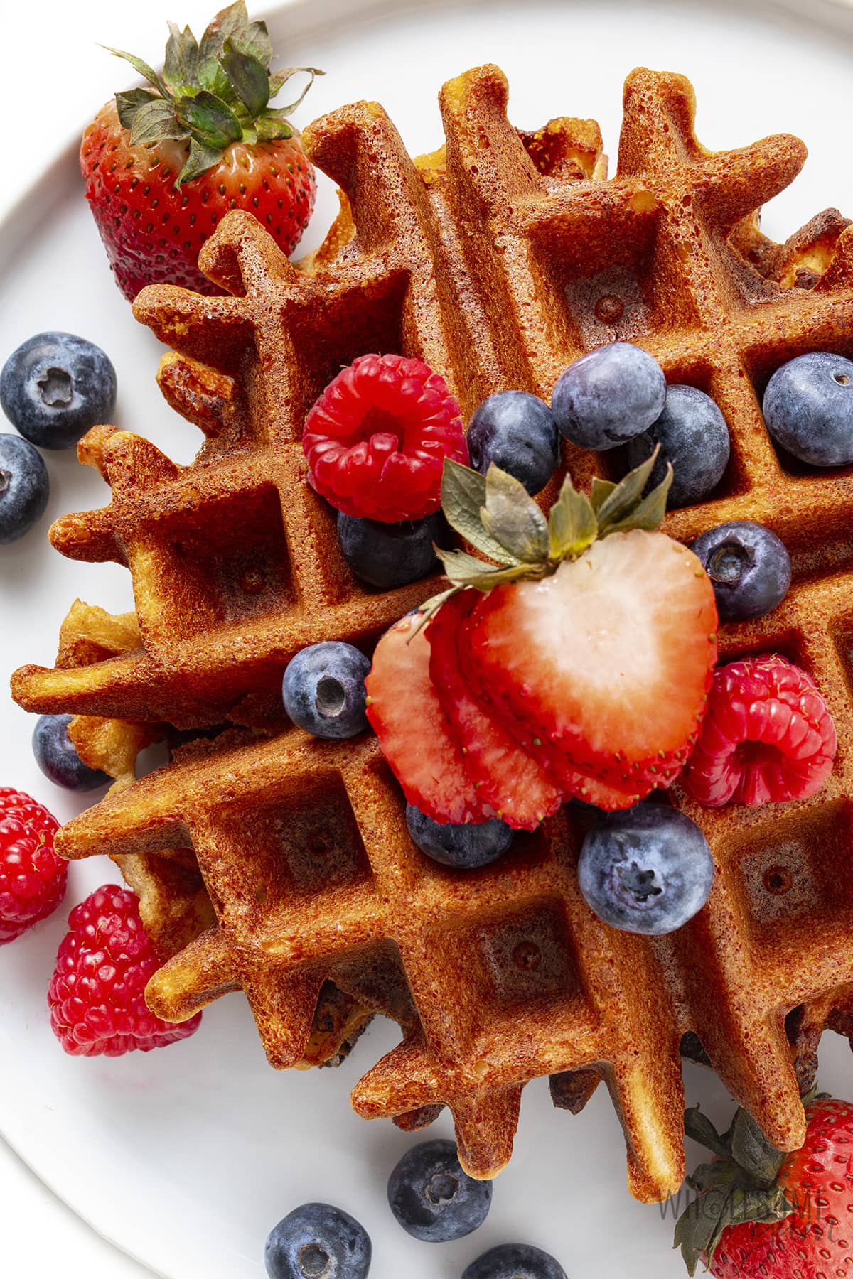 Keto waffle recipe with berries on top