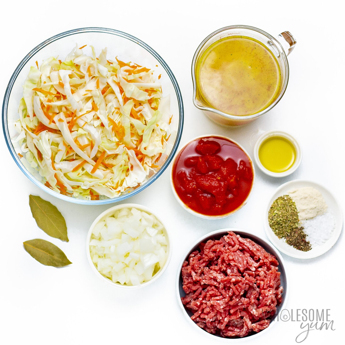 Ingredients for how to make cabbage soup in bowls.