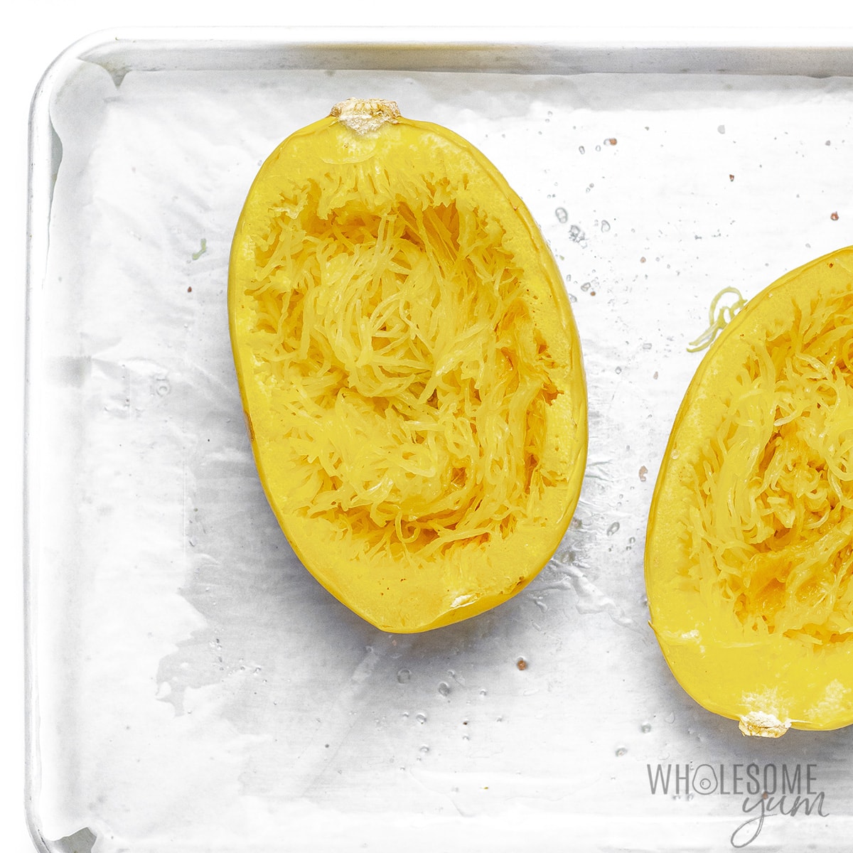 Spaghetti squash shells with strands released inside.