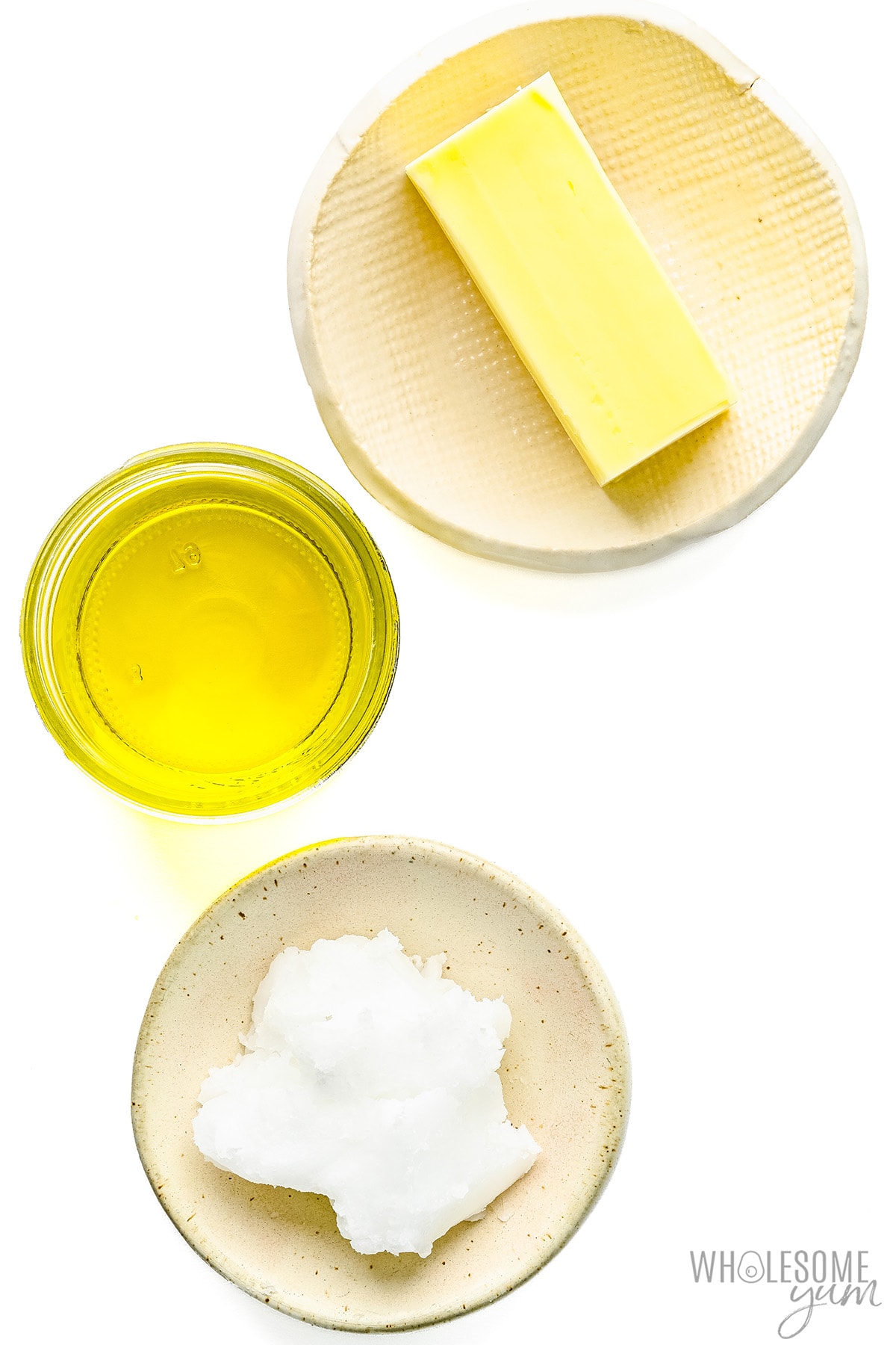 Oils and butter in separate dishes.
