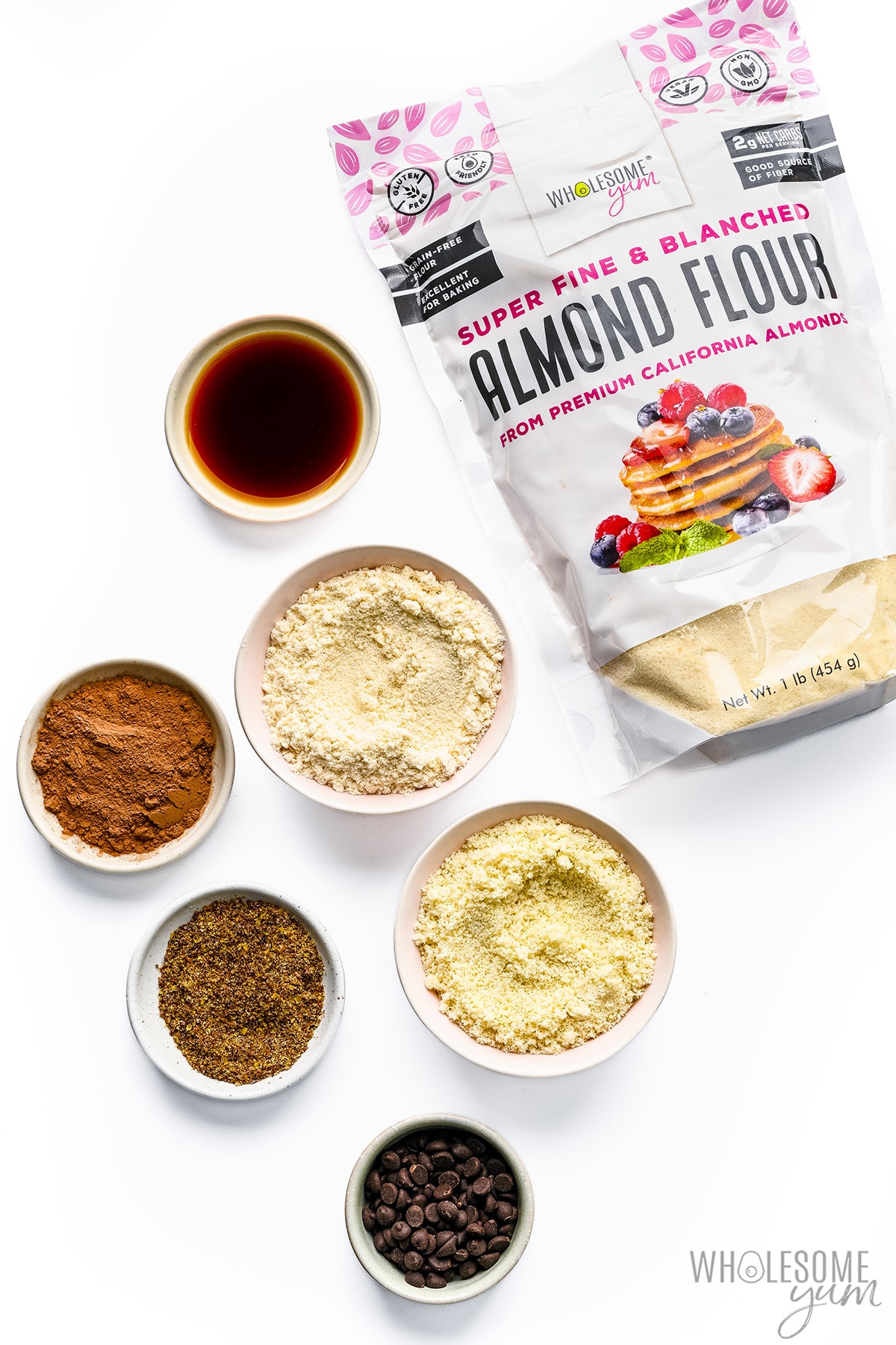 Wholesome Yum Almond Flour and other keto flours on white background.