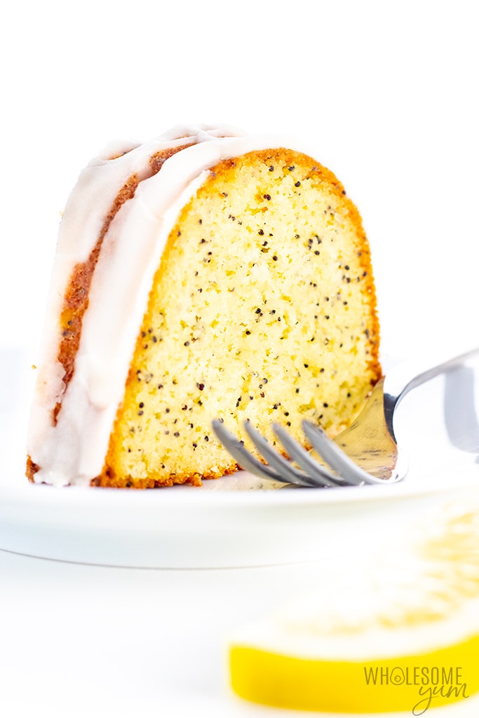 Slice of lemon pound cake on a plate with a fork - square