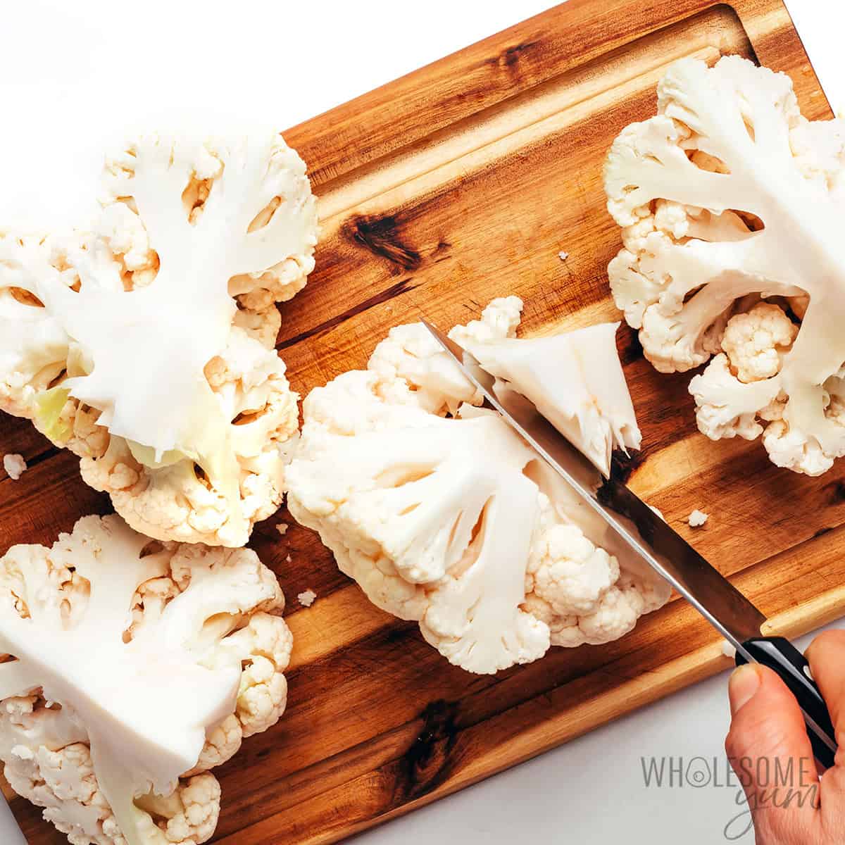 Removing cauliflower core.