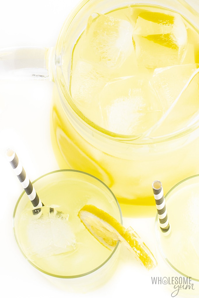 Overhead view of healthy lemonade in glasses and pitcher