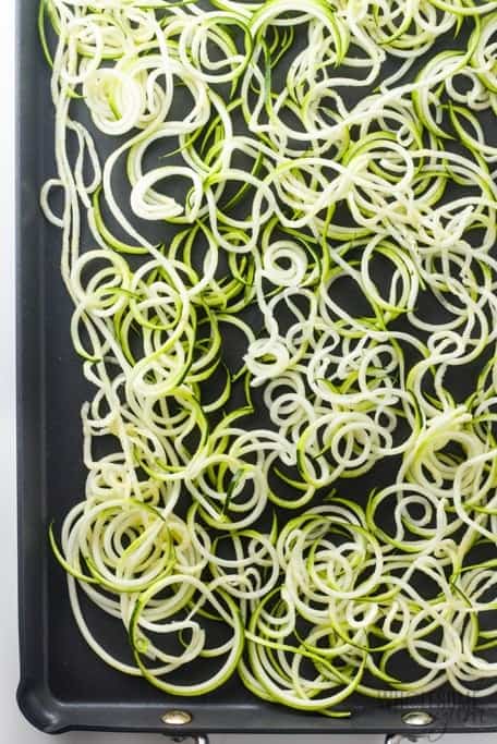 Raw zoodles arranged on a pan