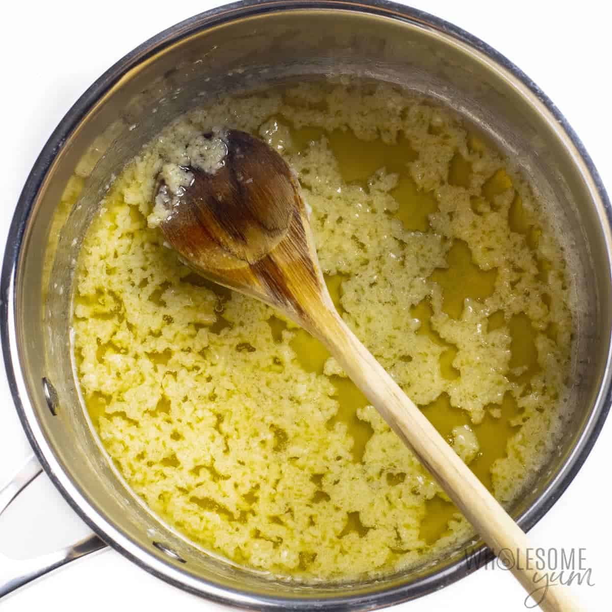 Garlic butter sauce for slow cooker wings in a saucepan