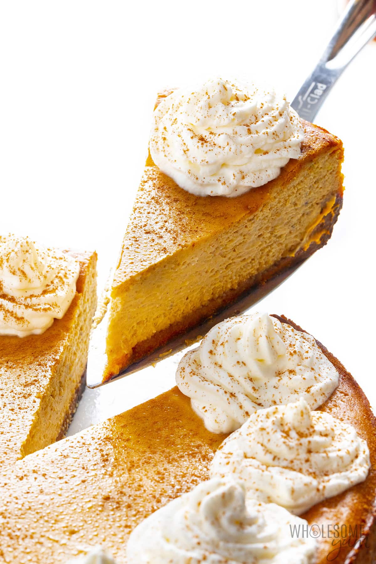 Front view of slices removed from pumpkin cheesecake.