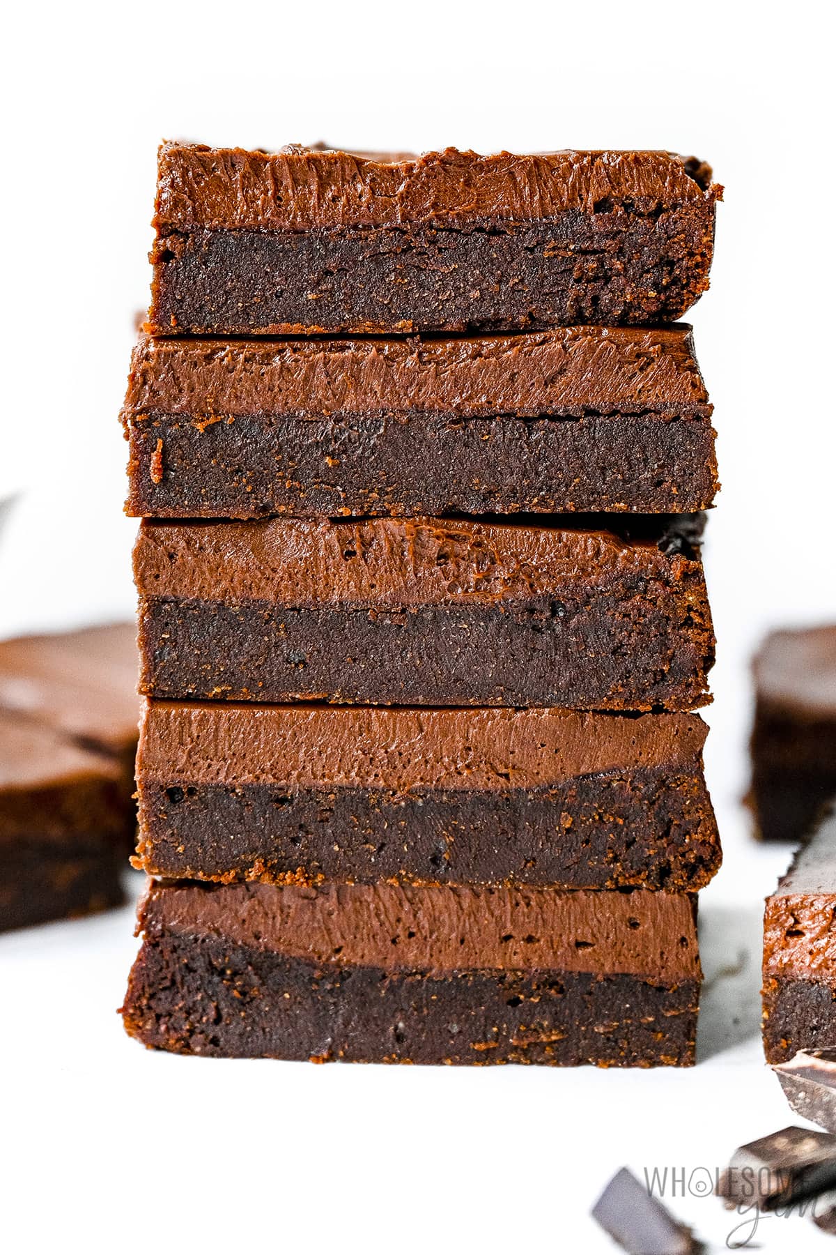 Almond flour keto brownies stacked on top of each other.